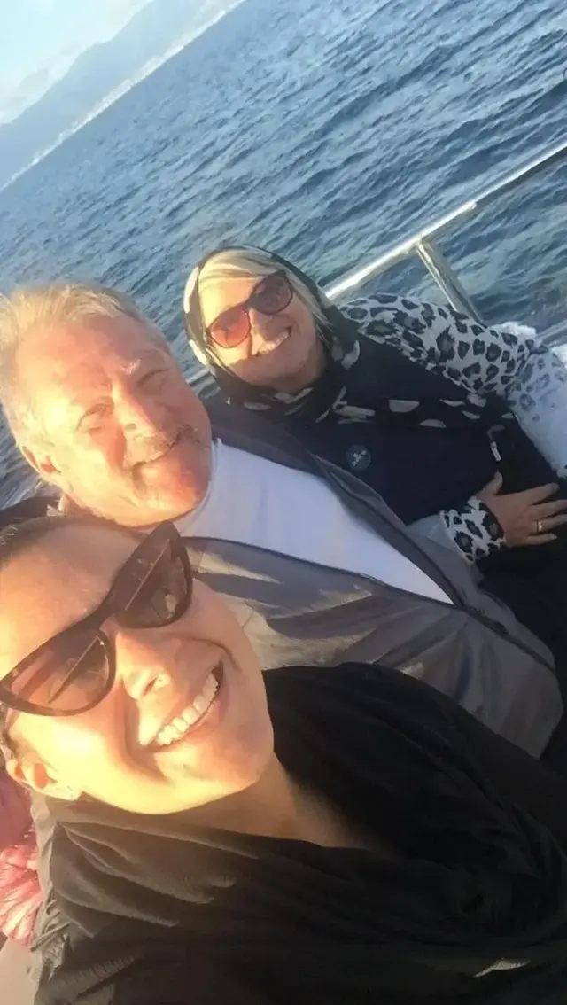 Couple on the boat at sunset