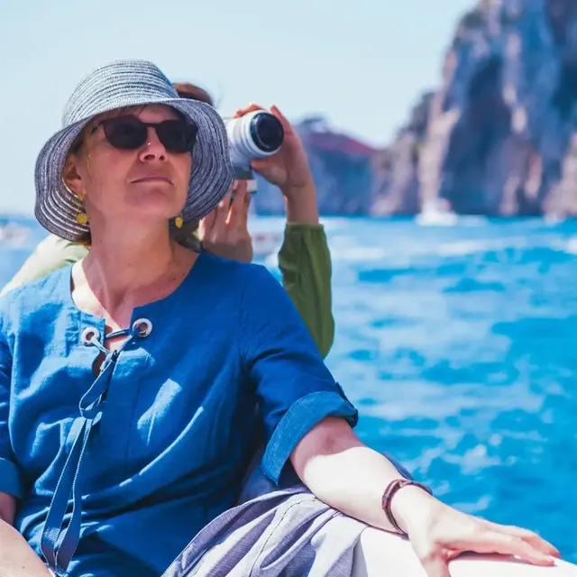 Guest on the boat in front of the Faraglioni