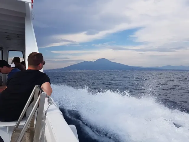 Boat wake with Vesuvius in the background