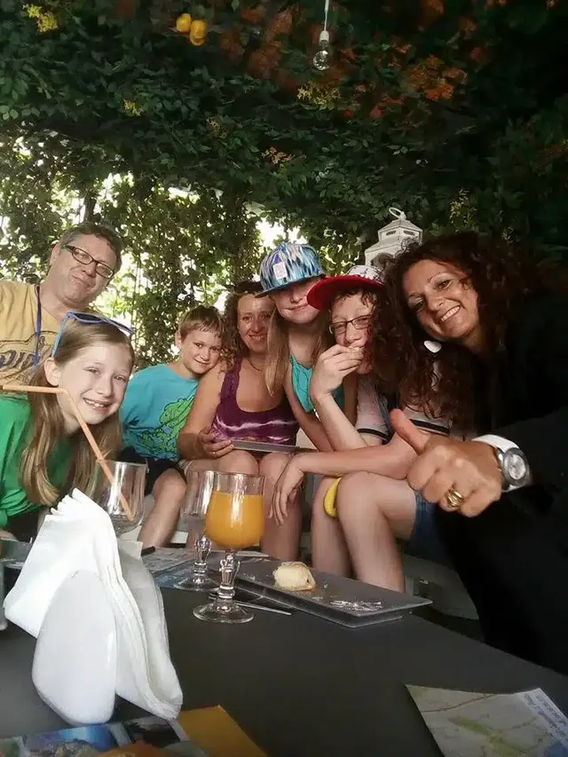Group at the table under the pergola